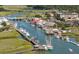 Vibrant waterfront scene with boats docked along the pier, restaurants and shops at 509 Klein St, Mount Pleasant, SC 29464
