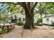 Backyard dining area with a large tree and a swing at 509 Klein St, Mount Pleasant, SC 29464