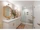 Beautiful bathroom featuring double vanity, gold fixtures, and a spacious walk-in shower with glass door at 509 Klein St, Mount Pleasant, SC 29464