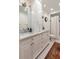 Bright bathroom features shaker style double sink vanity with marble countertops, hexagon tile floor and tub shower at 509 Klein St, Mount Pleasant, SC 29464