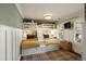 Unique bedroom design features custom bunk beds, wainscotting, neutral decor, and bright windows at 509 Klein St, Mount Pleasant, SC 29464