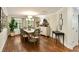 Spacious dining room featuring a large wooden table, elegant chandelier, and views of the outdoors at 509 Klein St, Mount Pleasant, SC 29464