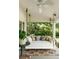 Comfortable front porch with a inviting daybed swing and plush pillows, creating a cozy outdoor space at 509 Klein St, Mount Pleasant, SC 29464