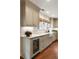 Kitchen featuring custom cabinets, marble countertops, and a built-in wine fridge for beverages at 509 Klein St, Mount Pleasant, SC 29464