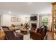 Inviting living room featuring a fireplace, comfortable seating, and ample natural light from the shuttered windows at 509 Klein St, Mount Pleasant, SC 29464