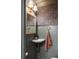 Stylish powder room with unique wallpaper and a corner sink at 509 Klein St, Mount Pleasant, SC 29464