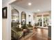 Cozy sitting room with hardwood floors, stylish mirrors, and comfortable seating perfect for conversation at 509 Klein St, Mount Pleasant, SC 29464