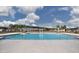Large community pool with clear blue water, multiple access points, and surrounding green space at 5302 Bending Flats Way, Summerville, SC 29485