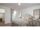 Serene bedroom with soft lighting, neutral decor, and a comfortable bed with a walk in closet at 5313 Bending Flats Way, Summerville, SC 29485