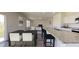 Open-concept living space featuring a modern kitchen with granite countertops and a dining area leading to the living room at 5313 Bending Flats Way, Summerville, SC 29485
