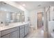 Modern bathroom with double vanity, tiled floors, and separate toilet room at 533 Richfield Way, Summerville, SC 29486