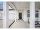 Inviting covered porch with seating and modern columns, enhancing curb appeal at 533 Richfield Way, Summerville, SC 29486