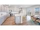 Spacious kitchen with gray cabinets, an island, and stainless steel appliances at 533 Richfield Way, Summerville, SC 29486