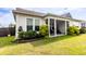 Well-maintained backyard features a lush lawn, well-manicured landscaping, and a covered patio, perfect for relaxing at 558 Pendleton Dr, Moncks Corner, SC 29461