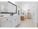 Bathroom boasts dual vanities, modern black fixtures, and bright lighting at 558 Pendleton Dr, Moncks Corner, SC 29461