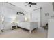 Serene bedroom with a white bed, soft carpet, and natural light from large windows at 558 Pendleton Dr, Moncks Corner, SC 29461