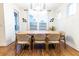 Bright dining area with a wooden table, seating for six and unique lighting fixtures at 558 Pendleton Dr, Moncks Corner, SC 29461