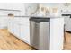 Spacious kitchen island with granite countertops, stainless steel dishwasher, and ample cabinet storage at 558 Pendleton Dr, Moncks Corner, SC 29461