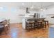 Modern kitchen with white cabinets, granite countertops, island and stainless steel appliances at 558 Pendleton Dr, Moncks Corner, SC 29461