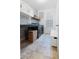 Well-organized laundry room with stylish blue patterned wallpaper, storage, washer, and dryer at 558 Pendleton Dr, Moncks Corner, SC 29461