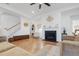 Inviting living room with a cozy fireplace, hardwood floors, and comfortable seating at 558 Pendleton Dr, Moncks Corner, SC 29461