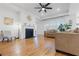 Spacious living room featuring a fireplace, hardwood floors, and ample natural light at 558 Pendleton Dr, Moncks Corner, SC 29461