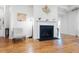 Cozy living room showcasing fireplace, hardwood floors and decorative accents at 558 Pendleton Dr, Moncks Corner, SC 29461