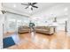 Spacious living room with large windows, hardwood floors and contemporary furniture arrangement at 558 Pendleton Dr, Moncks Corner, SC 29461