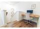 Bright office nook featuring hardwood floors, a built-in desk, and decorative mirrors on adjacent wall at 558 Pendleton Dr, Moncks Corner, SC 29461