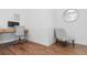 Cozy office nook features stylish gray chair, wood floors, and decorative wall art at 558 Pendleton Dr, Moncks Corner, SC 29461