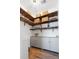 Well-organized pantry with wooden shelves, cabinets, and ample storage space for kitchen essentials at 558 Pendleton Dr, Moncks Corner, SC 29461