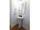 Stylish powder room featuring a pedestal sink, modern fixtures, and elegant design at 558 Pendleton Dr, Moncks Corner, SC 29461