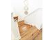 A bird's eye view of the wooden staircase with white walls adorned with decorative circular mirrors at 558 Pendleton Dr, Moncks Corner, SC 29461