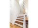 Bright staircase features hardwood treads, white risers, and a stylish arrangement of decorative mirrors at 558 Pendleton Dr, Moncks Corner, SC 29461