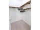 Walk-in closet offers carpet flooring and custom wood shelving and hanging racks at 558 Pendleton Dr, Moncks Corner, SC 29461