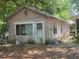 Exterior shot of building with a weathered facade, showing potential for renovation and creative design at 6385 Sc-162, Hollywood, SC 29449