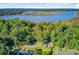 Gorgeous aerial view of a wooded lot with waterfront access, offering privacy and scenic beauty at 7074 W Constellation Dr, North Charleston, SC 29418