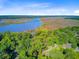 Scenic aerial shot of the home nestled among trees with amazing river views at 7074 W Constellation Dr, North Charleston, SC 29418