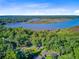 Overhead view showing the home is surrounded by mature trees and close proximity to the river and marsh at 7074 W Constellation Dr, North Charleston, SC 29418