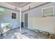Back entrance featuring a covered patio, windows, and an entry door at 7074 W Constellation Dr, North Charleston, SC 29418