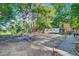 Large, tree-filled backyard perfect for pets, with a truck and trailer parked for convenience at 7074 W Constellation Dr, North Charleston, SC 29418