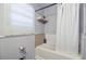 This bathroom features a shower and bathtub combo and fair lighting at 7074 W Constellation Dr, North Charleston, SC 29418