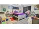 This bedroom has fair lighting, dark curtains and laminate wood floors at 7074 W Constellation Dr, North Charleston, SC 29418