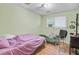 A bedroom with an AC window unit, fair lighting and laminate wood floors at 7074 W Constellation Dr, North Charleston, SC 29418