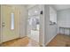 Welcoming entryway flowing into a bright kitchen featuring stainless steel appliances and tiled flooring at 7074 W Constellation Dr, North Charleston, SC 29418