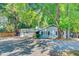 Side exterior showcasing the building with ample parking and mature landscaping at 7074 W Constellation Dr, North Charleston, SC 29418
