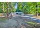 Spacious property with mature trees, offering a serene and private setting at 7074 W Constellation Dr, North Charleston, SC 29418