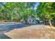 Side exterior showcasing the building with ample parking and mature landscaping at 7074 W Constellation Dr, North Charleston, SC 29418