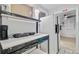 Efficient kitchen setup with essential appliances and convenient access to adjacent areas at 7074 W Constellation Dr, North Charleston, SC 29418