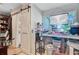 This kitchen area has wooden sliding doors, a coffee machine and a view of the outdoors at 7074 W Constellation Dr, North Charleston, SC 29418